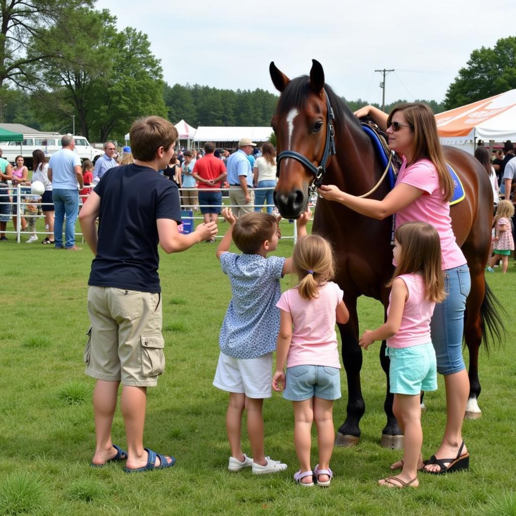 Families enjoy the festive atmosphere of the Deerfield Fair Horse Show