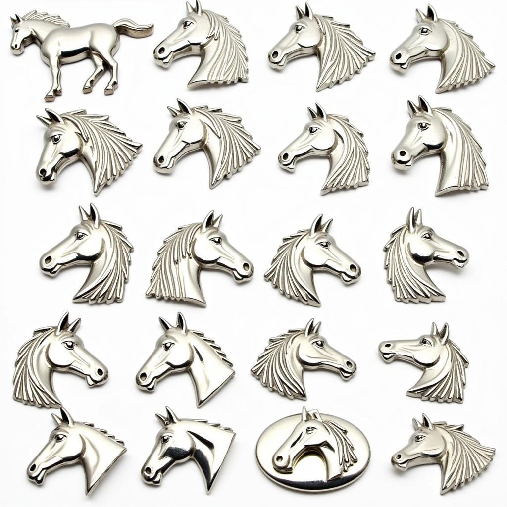 Different styles of silver horse belt buckles on display