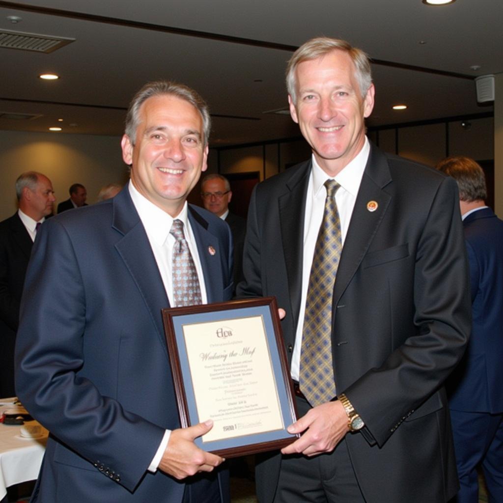 Greg Wolf receiving an award for his contribution to horse racing