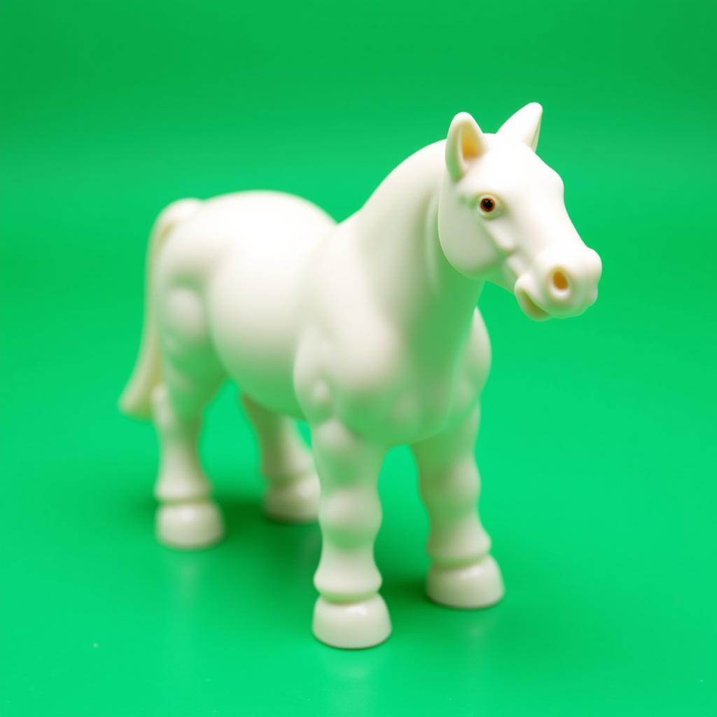 A white lego horse standing on a green baseplate