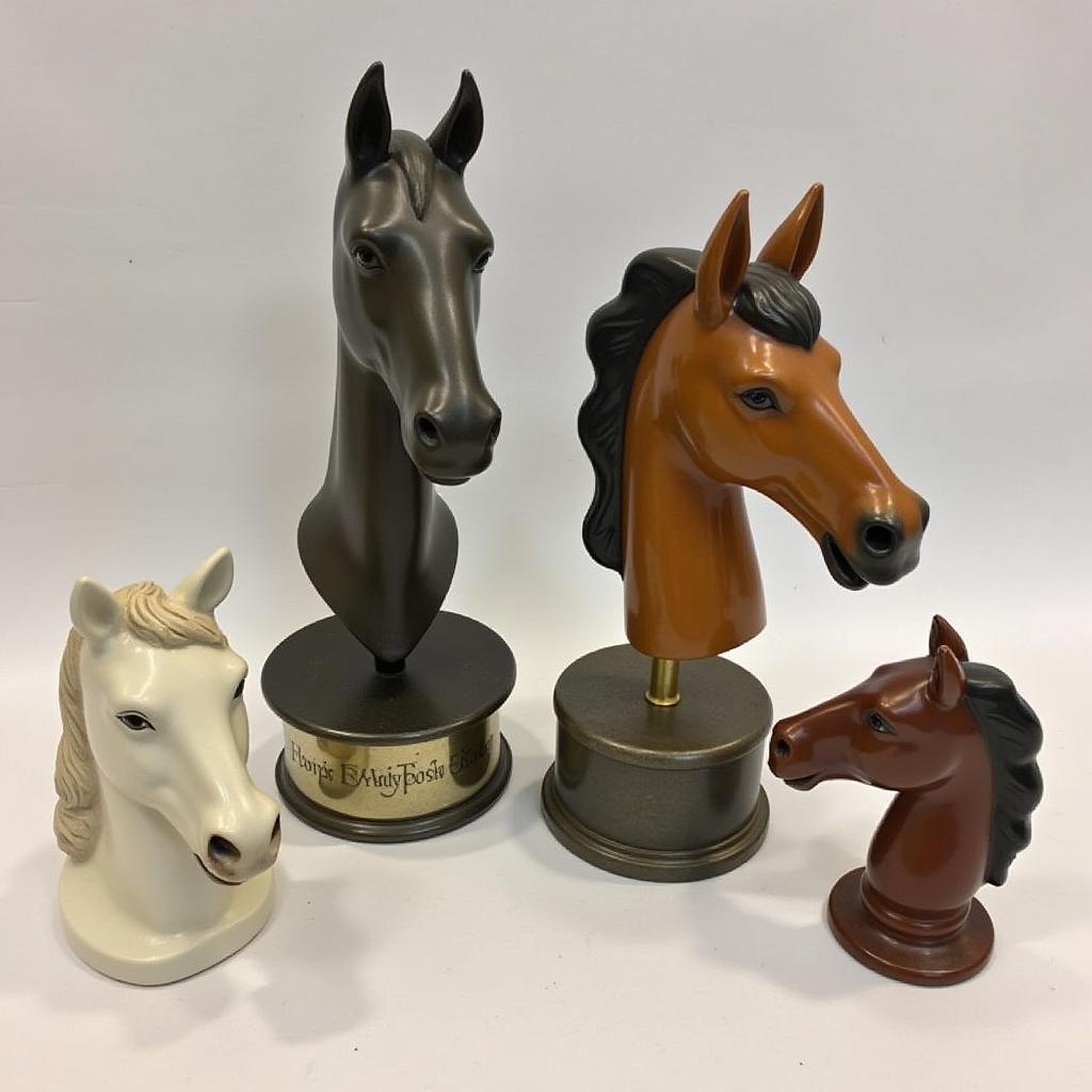 A collection of diverse vintage horse head ashtray stands showcasing different styles, materials, and sizes.